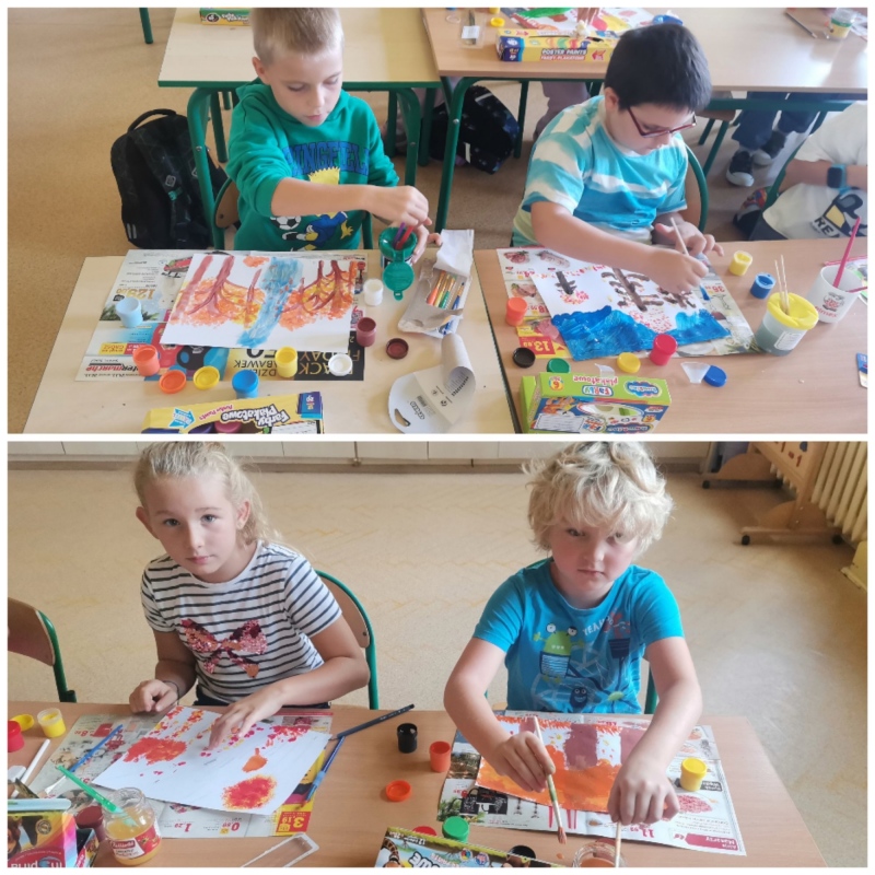 Dzieci klasy 2a malują farbami jesienny krajobraz